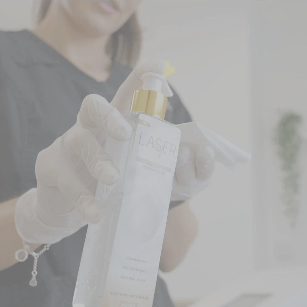 women pressing down aloe vera gel bottle dispenser